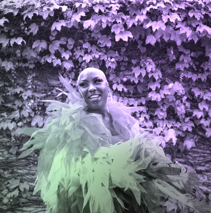 Shirley Raines in a vibrant purple and green portrait